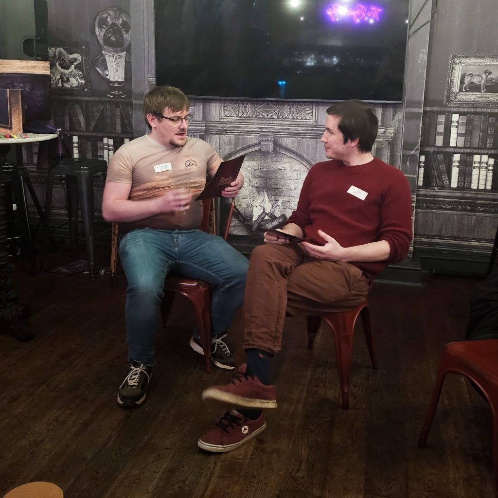 Two players discussing at Blood on the Clocktower social deduction game