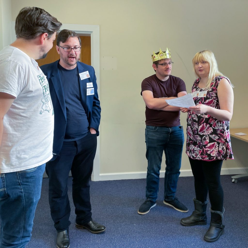 Becky showing the King a document with the Scots