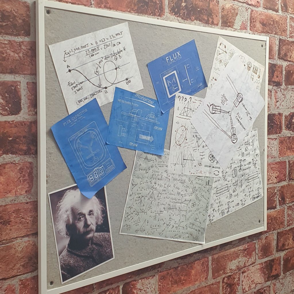 Blueprints on a noticeboard