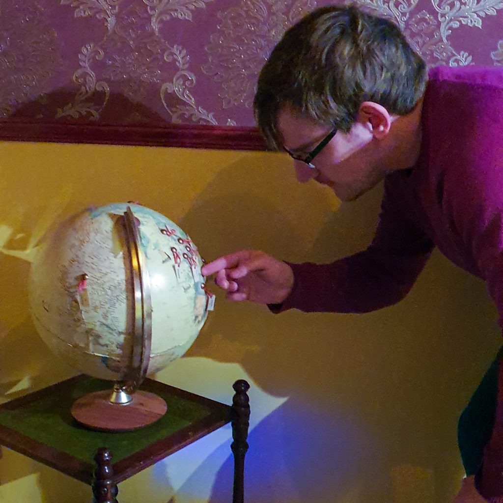 Looking at a globe - Sherlocked In by The Escapologist, Leeds escape room review by BeckyBecky Blogs