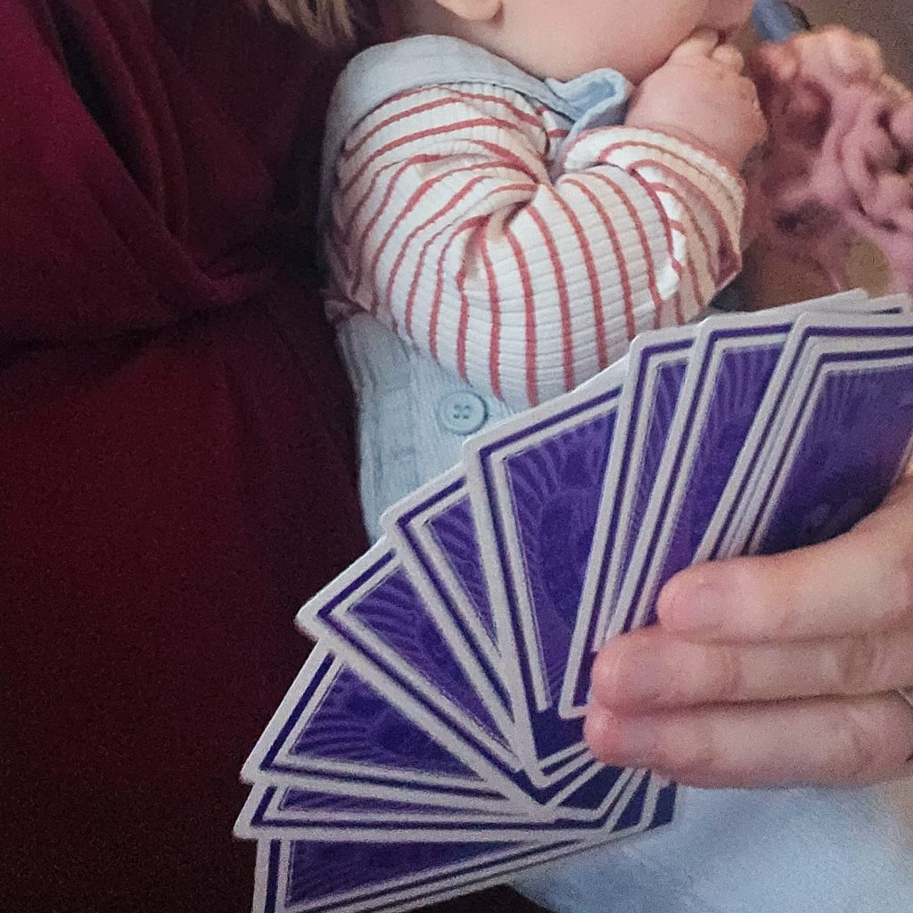 Hand of cards from Scout, a boardgame you can play with a baby around