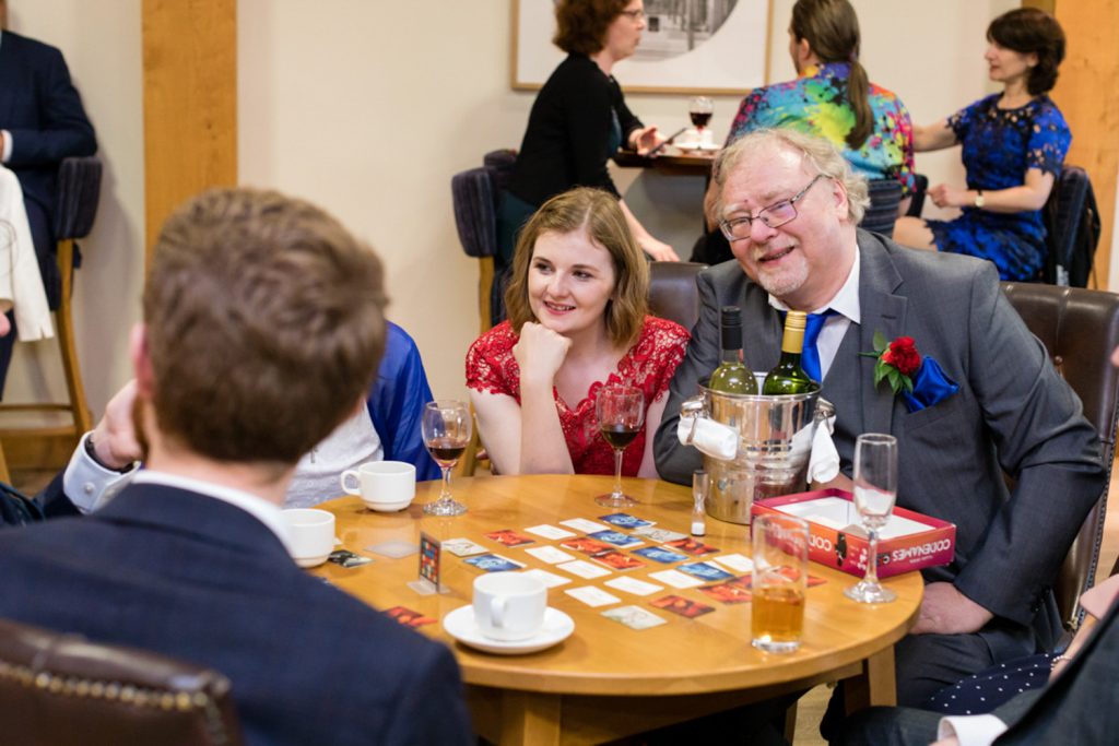Becky's dad and a bridesmaid playing Codenames