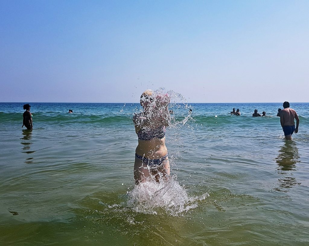 Enjoying the sea at Carcavelos beach - Things to Do in Lisbon, Portgual, travel blog by BeckyBecky Blogs