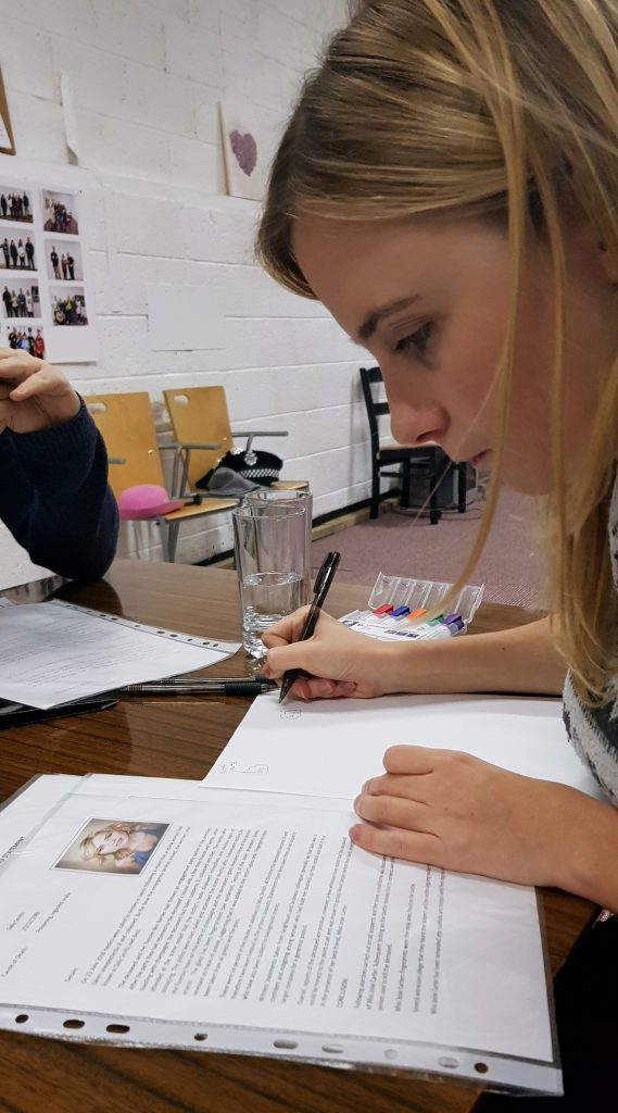 Ellie working hard - Who Killed Sally, escape room by NH Events, review by BeckyBecky Blogs