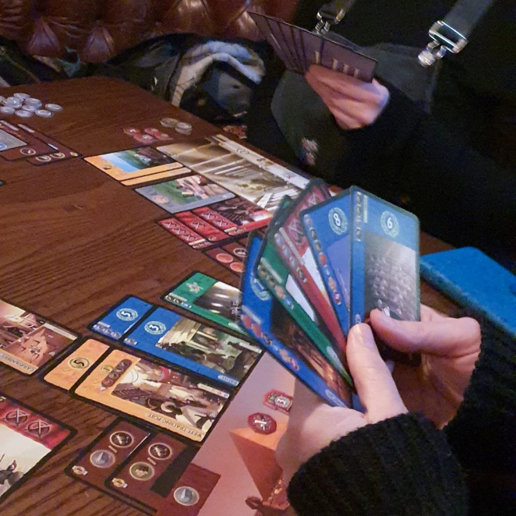 A hand of cards for the 7 Wonders board game