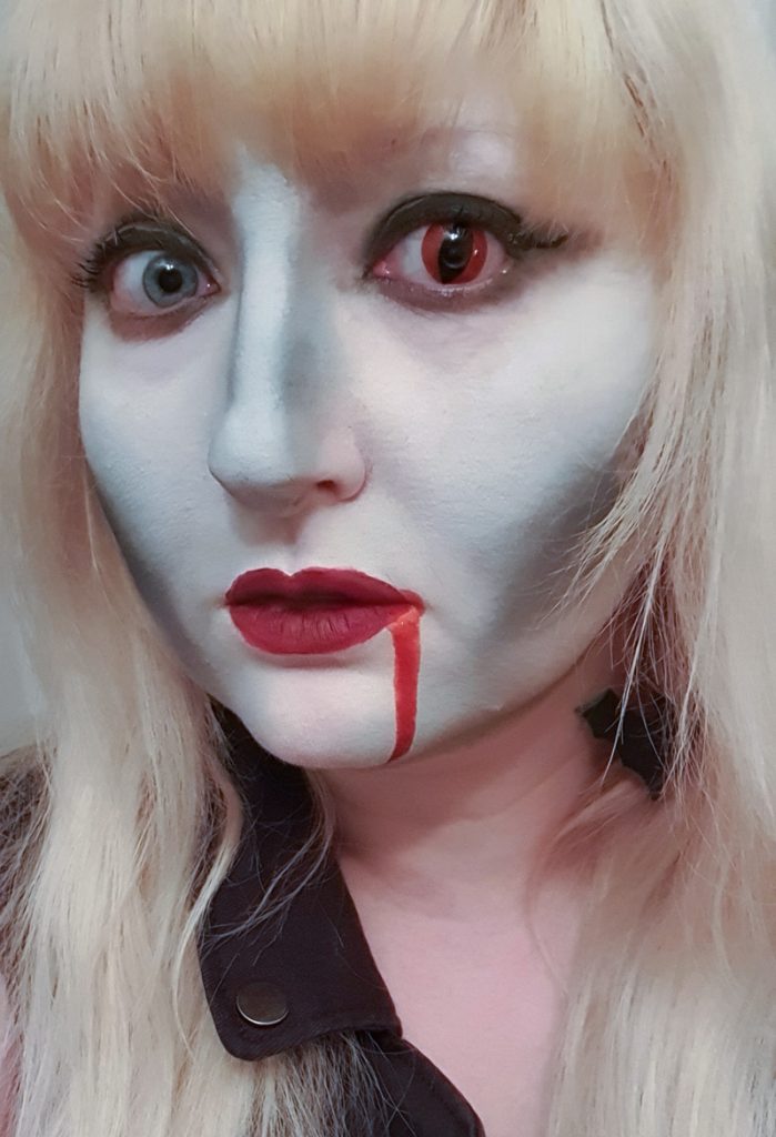 A close-up on my Halloween makeup, including a red cats-eye contact