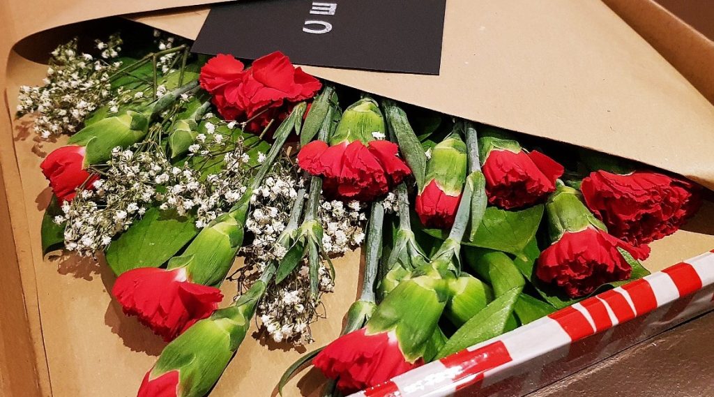 A box full of red carnations