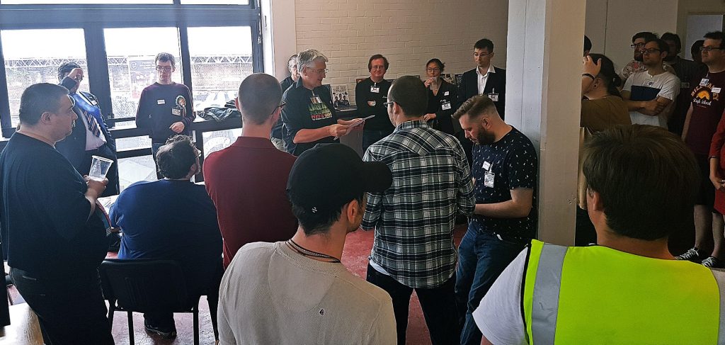 Jim Wallman giving the opening briefing - Urban Nightmare: State of Chaos, the Wide Area Megagame, After Action Report by BeckyBecky Blogs